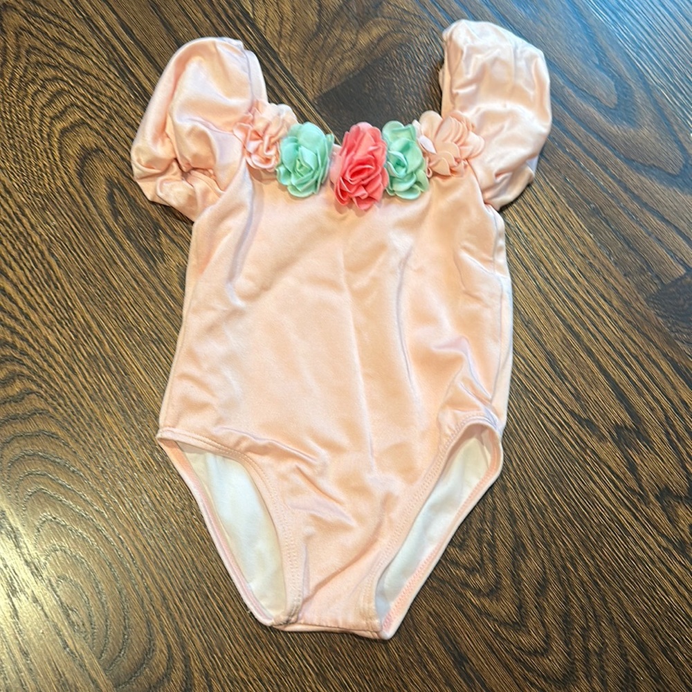 Janie and Jack pink puff shoulder swimsuit with floral appliqués. 18-24months